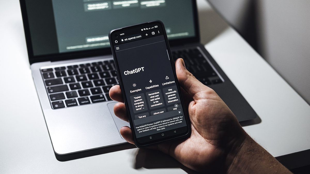 Screen with ChatGPT chat with AI or artificial intelligence. Man search for information using artificial intelligence chatbot developed by OpenAI. Warsaw, Poland December 02, 2022